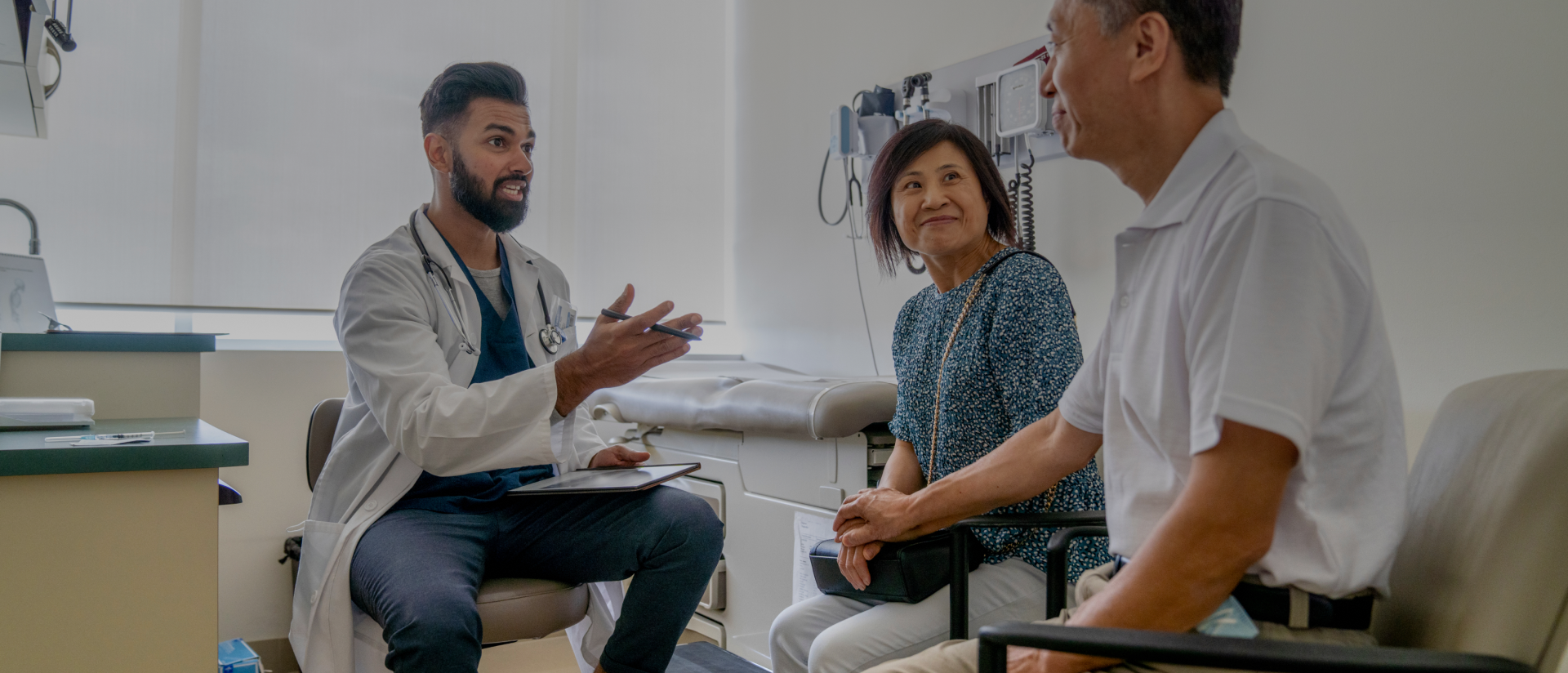a doctor speaking to a couple