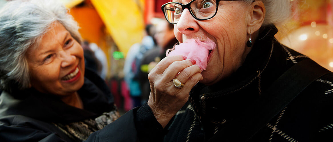 two women eating candyfloss