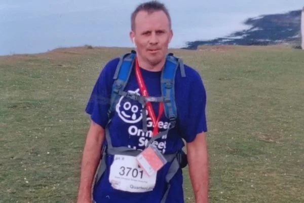 man on beach ready to take part in a run