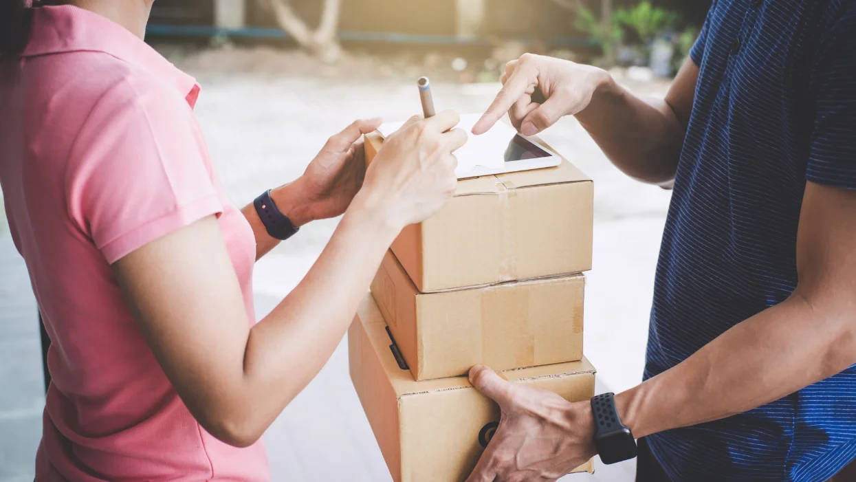 a few people opening boxes