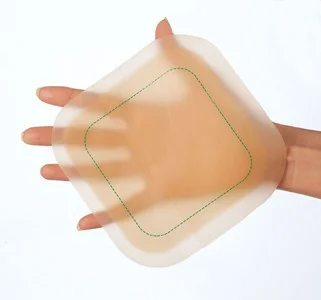 hands holding a wound dressing