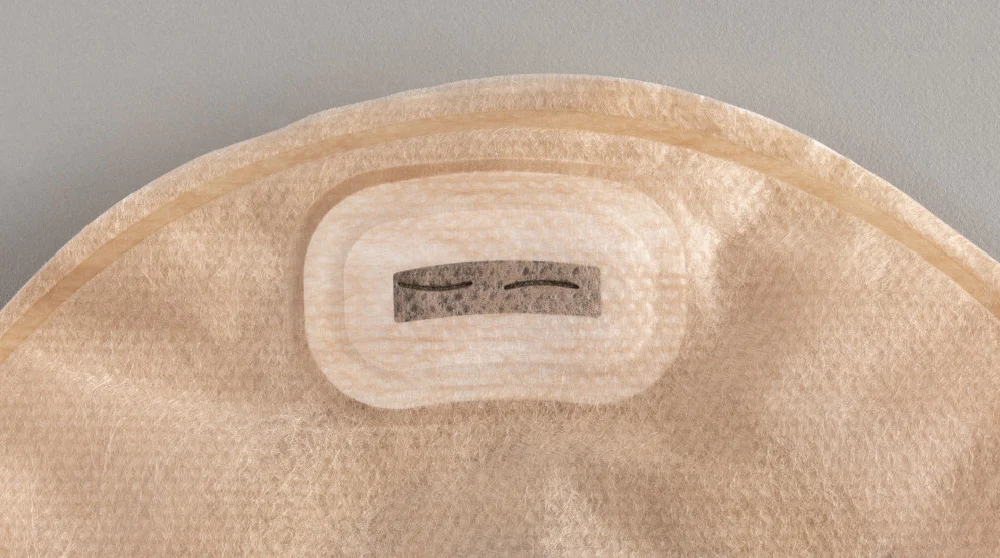 a close-up of an ostomy pouch with a filter