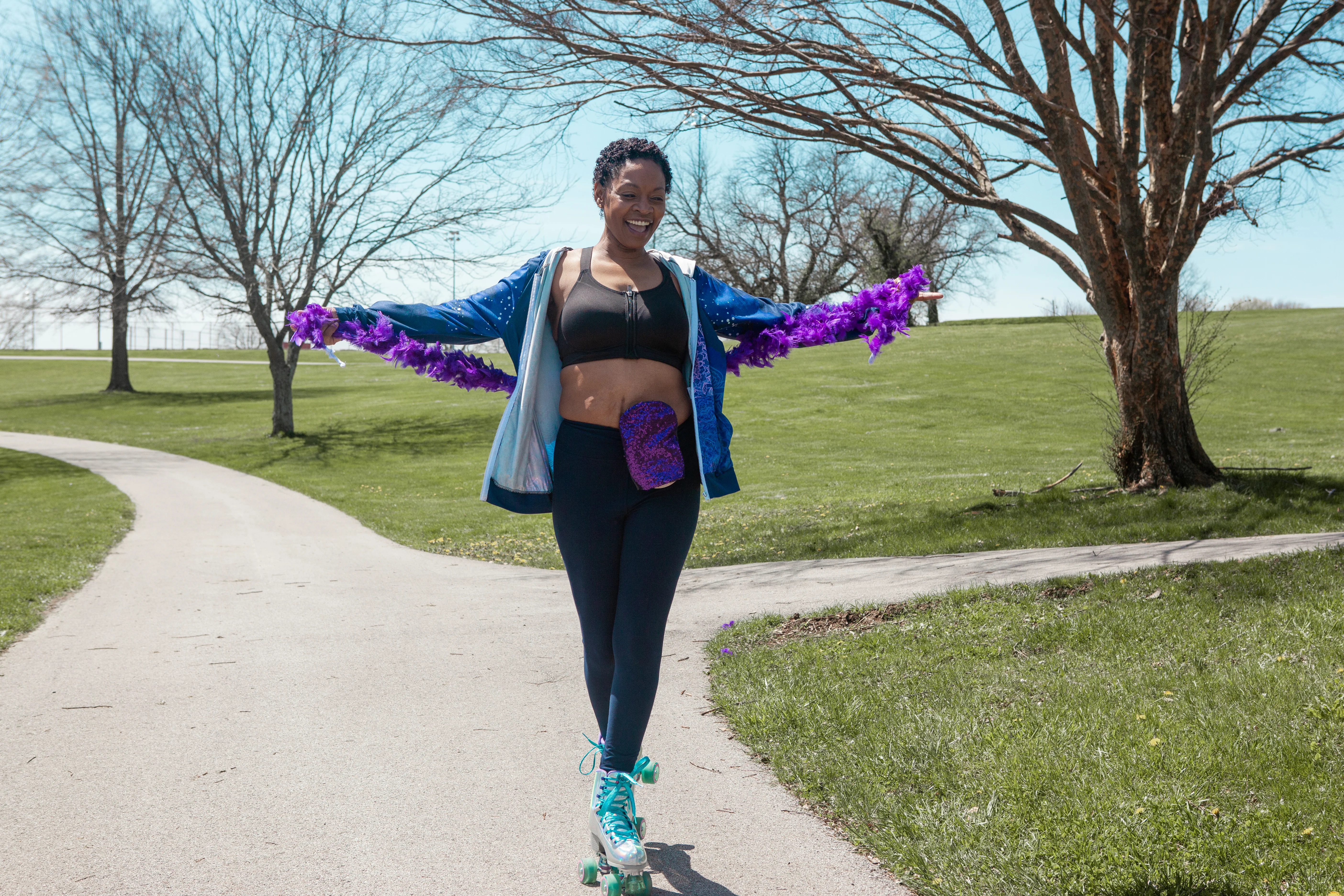 a woman on rollerskates wearing a feather boa