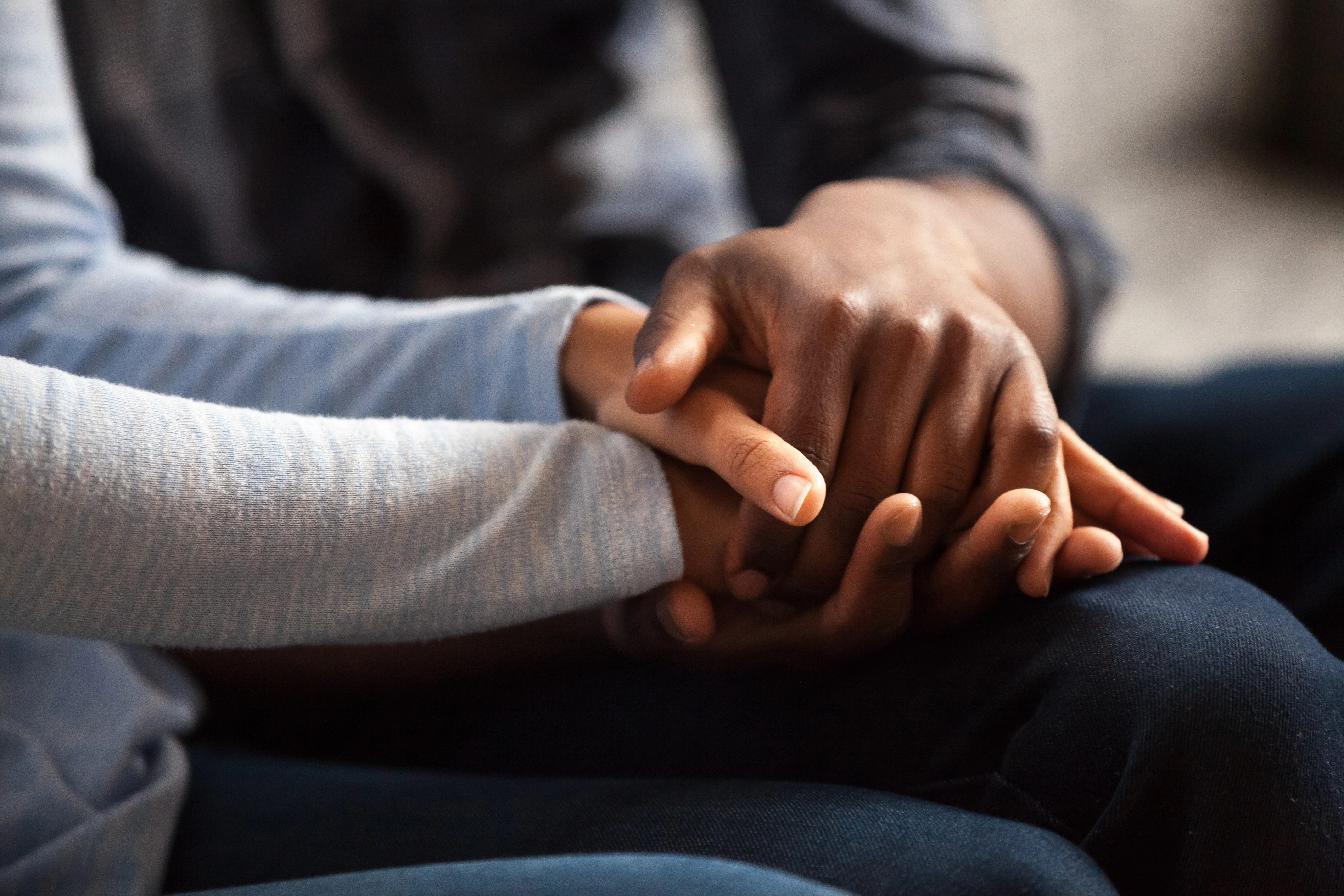 a close-up of a person holding a hand