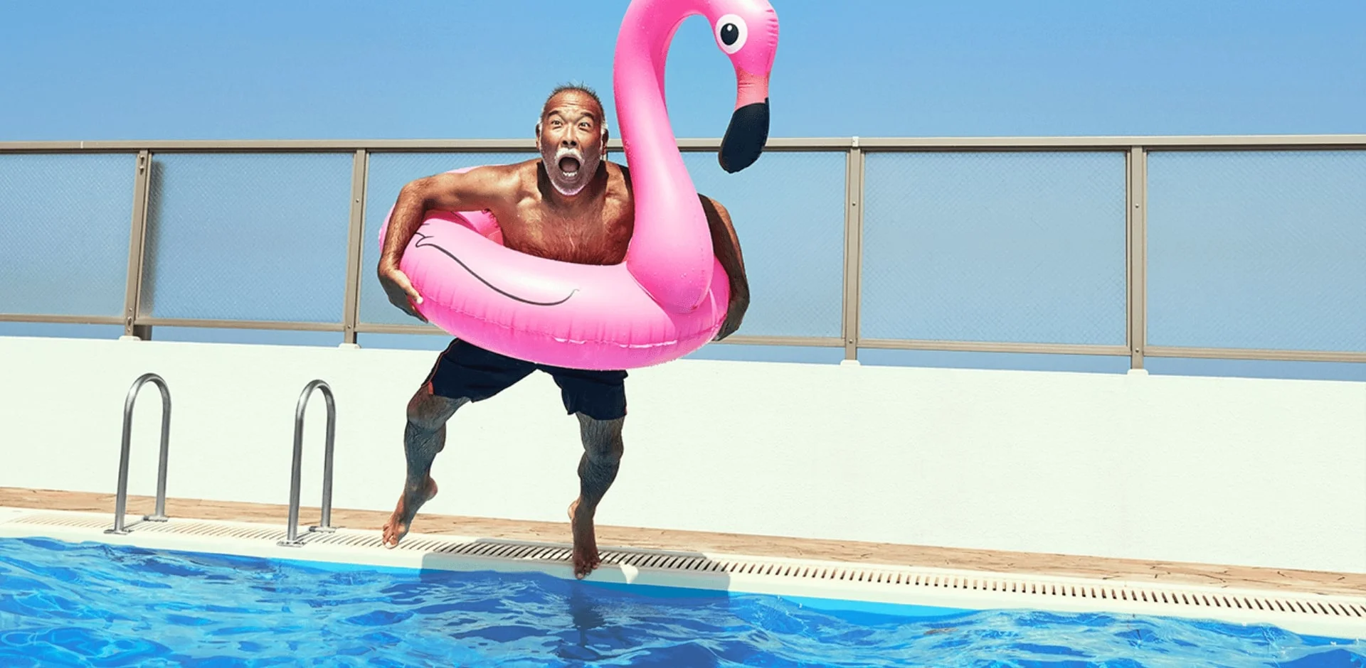 a person jumping into a pool
