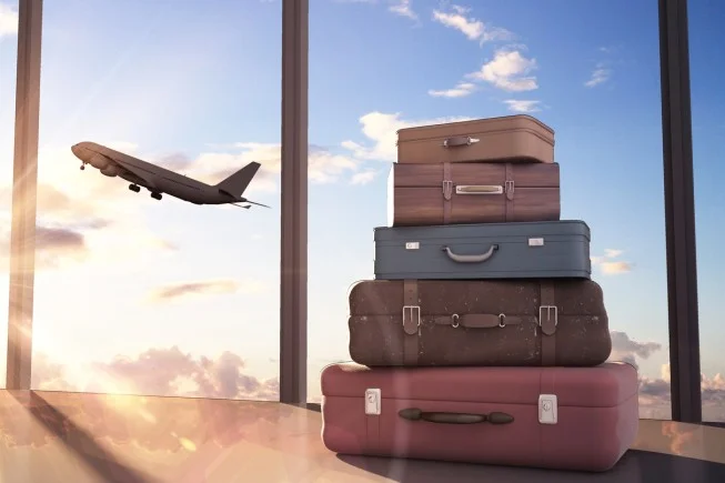 a group of suitcases sit on top of a table