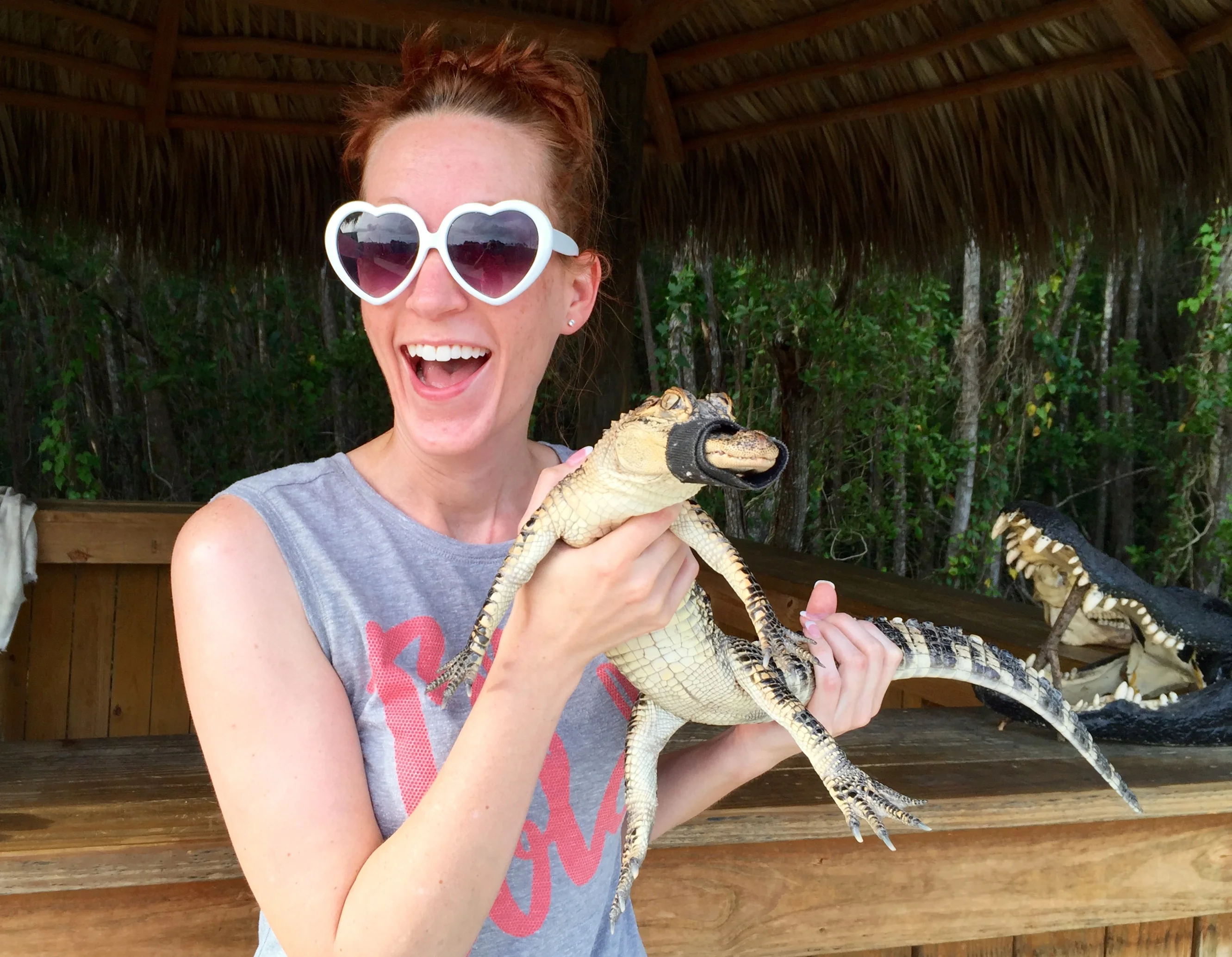 a woman holding a snake