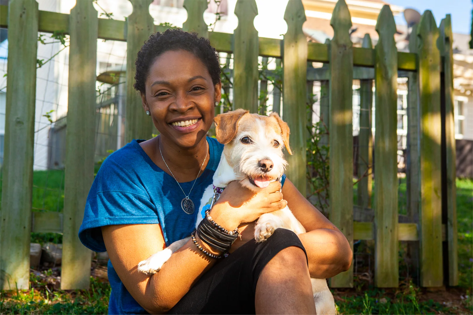 a person holding a dog